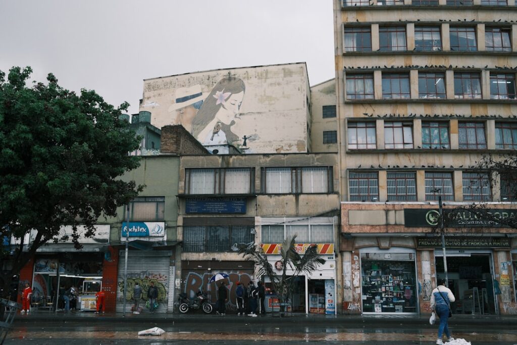 Buildings and storefronts line a city street.
