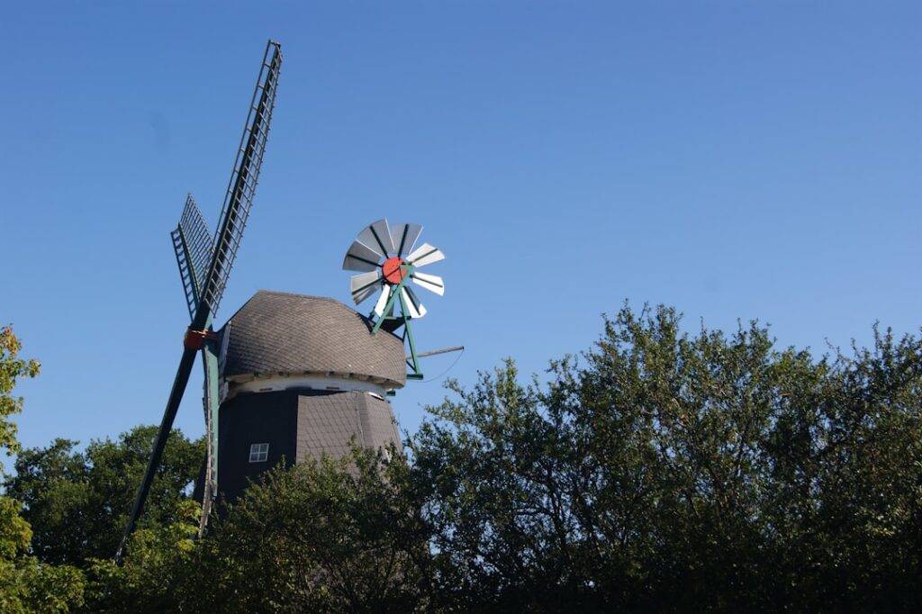a windmill next to a building