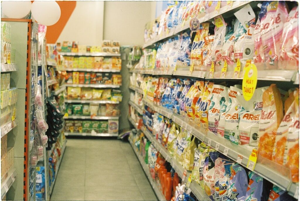 A grocery store aisle filled with lots of food